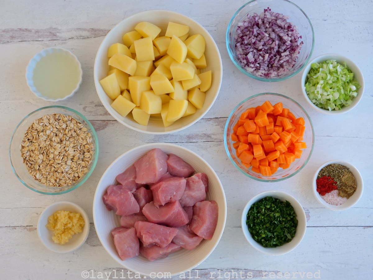Ingredients needed to make an oatmeal soup with vegetables and pork on a counter