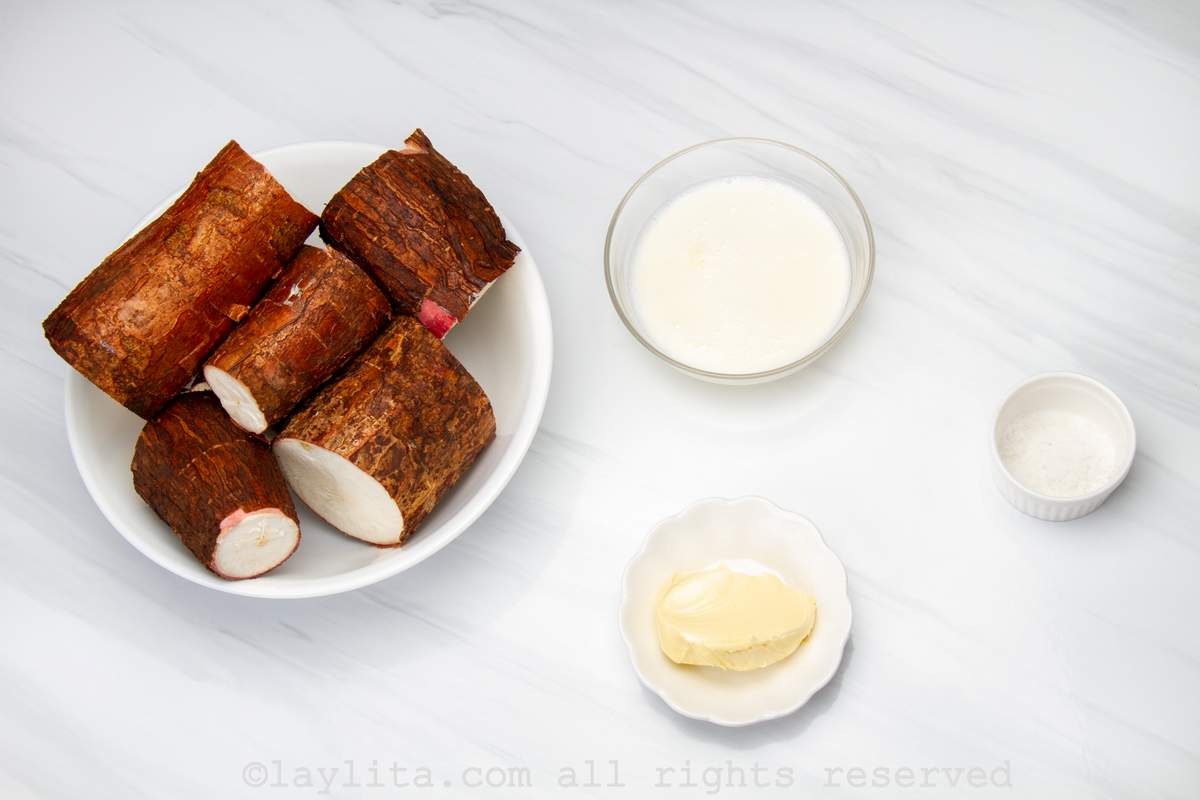 Ingredients needed to make mashed yuca or cassava purée on a kitchen counter