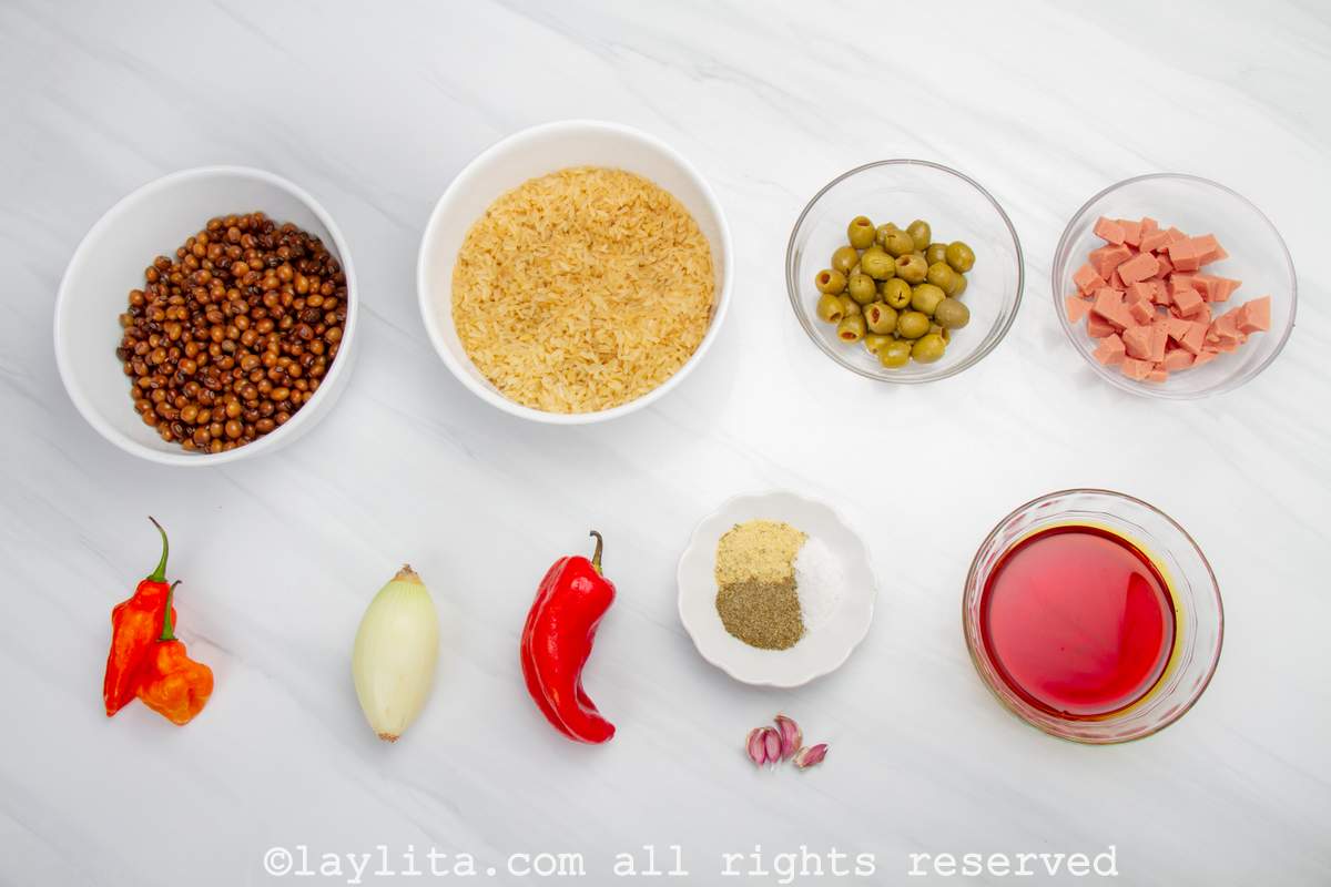 Ingredients needed for Puerto Rican Arroz con Gandules or Rice with Pigeon Peas on a white countertop