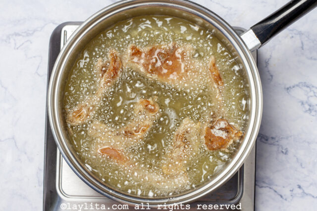 Chicken chicharrones being fried in oil