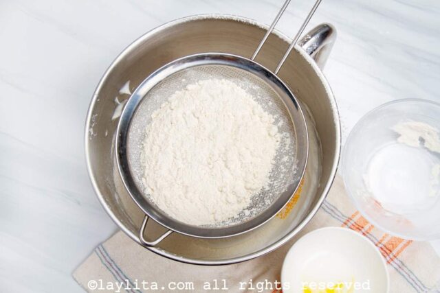Sifting flour for a sponge cake
