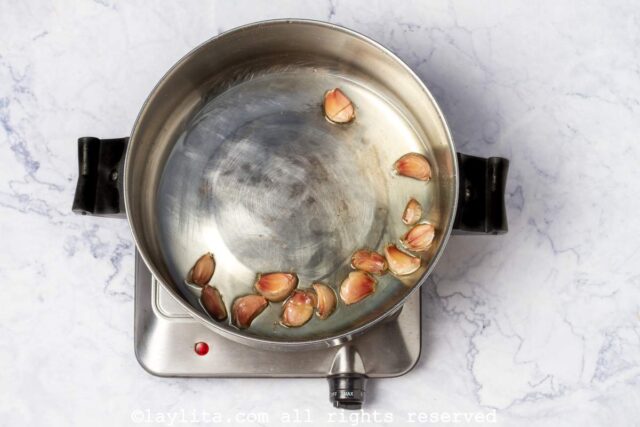 Roasted whole garlic cloves in olive oil