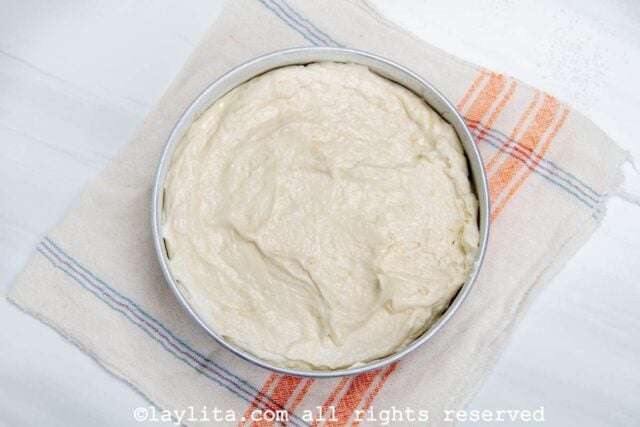 Raw cake batter in a pan before baking