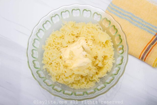 Adding butter to mashed potatoes