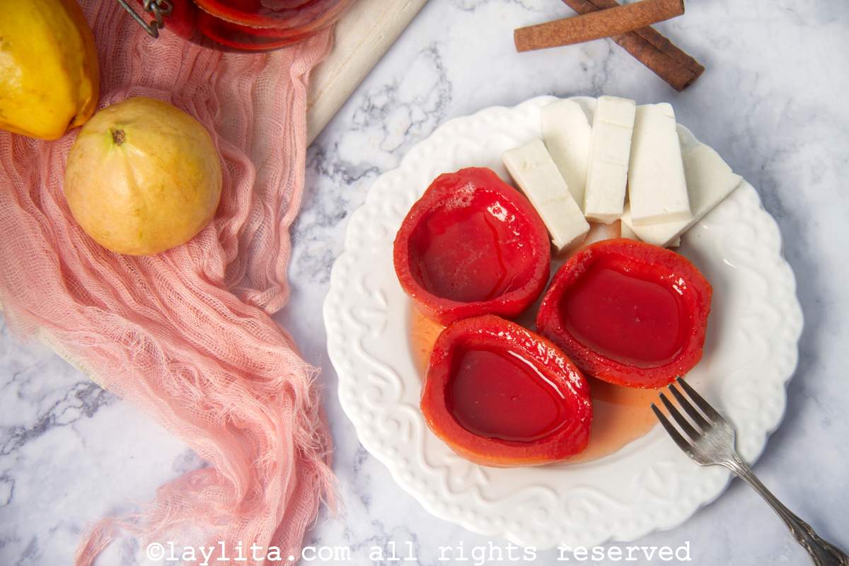 Overhead shot of cascos de guayaba or guava shells on a plate served with cheese.