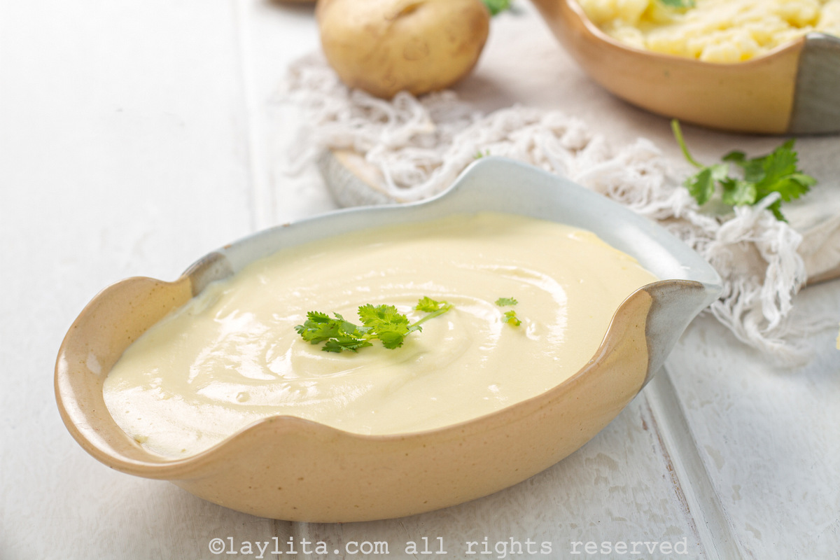 Side view of French style mashed potatoes in a serving bowl.