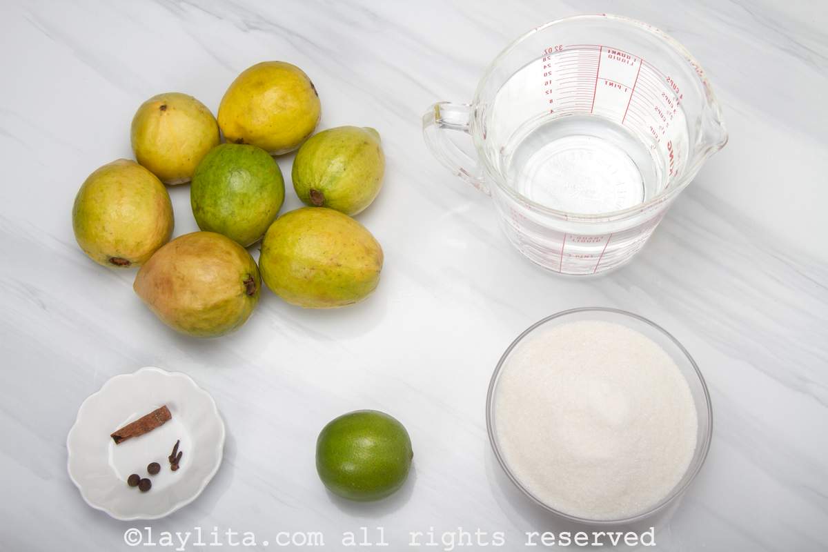 Ingredients needed for Cascos de Guayaba or candied guava shells in syrup on a kitchen counter