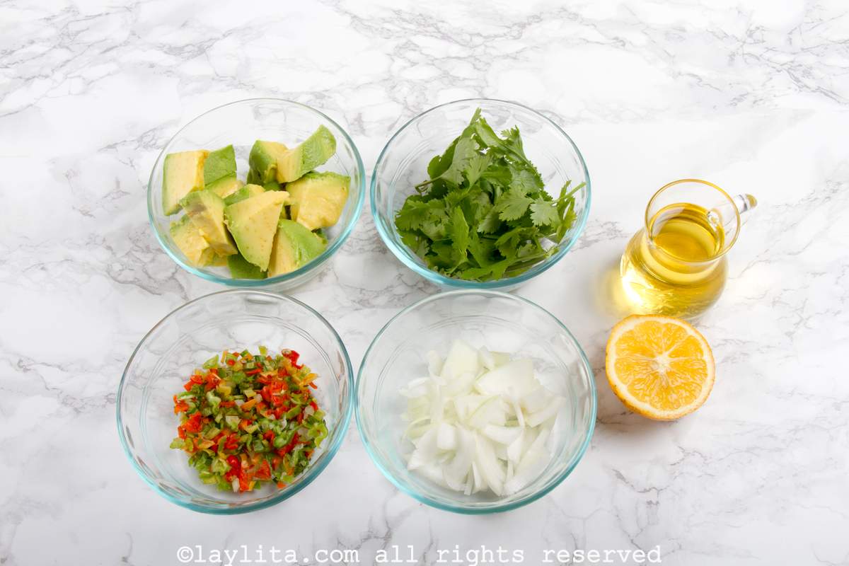 Ingredients for Venezuelan Avocado Sauce or Guasacaca on a kitchen counter