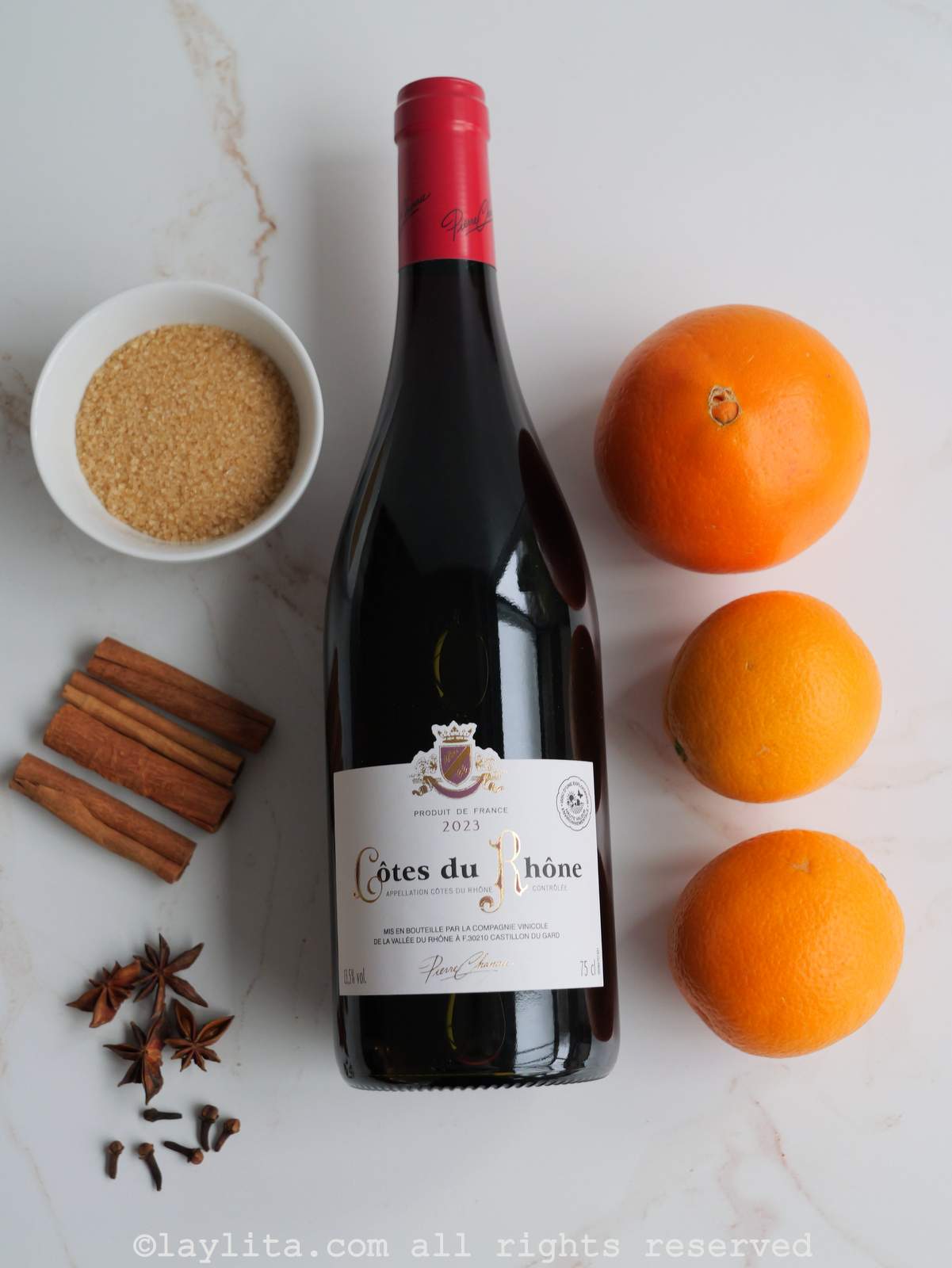 Ingredients needed for vino caliente or Glühwein on a kitchen counter.
