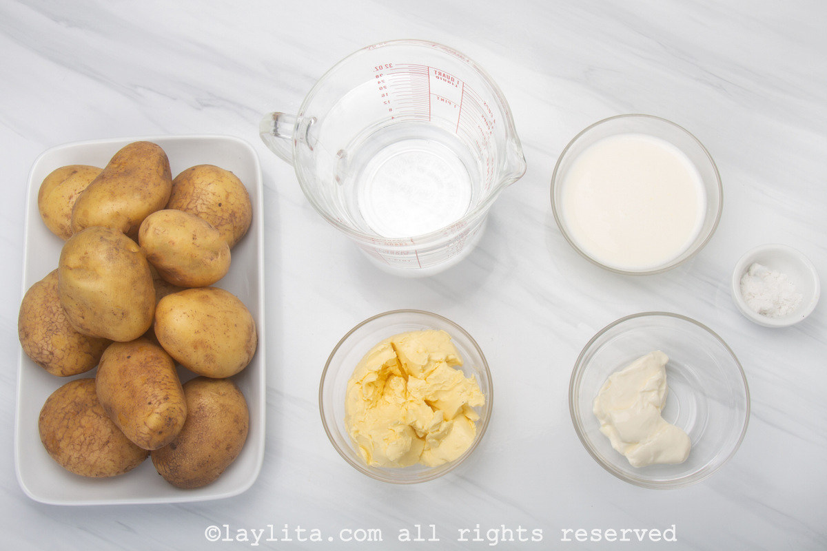 Ingredients needed to make homemade mashed potatoes on a counter
