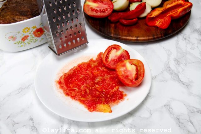Tomatoes grated on a plate.
