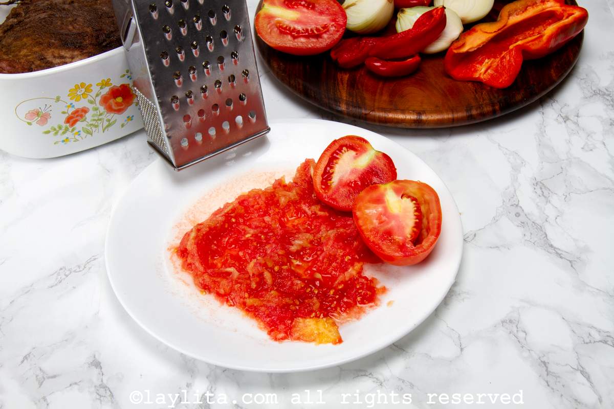 Tomatoes grated on a plate.