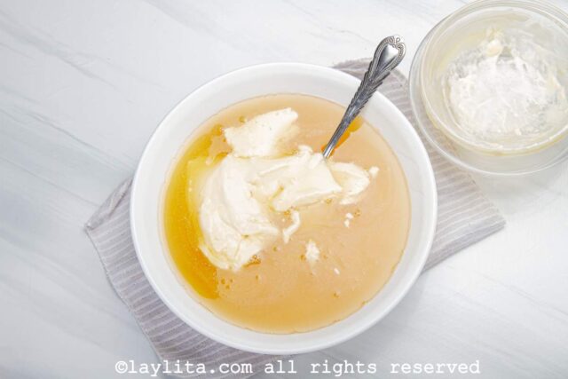Unflavored gelatin being mixed with cream and condensed milk