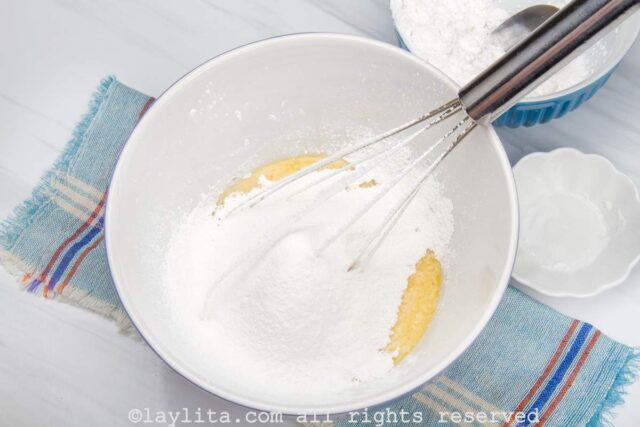 Tapioca starch being added to a mixing bowl