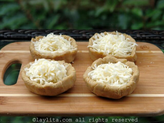 Filling the green plantain patties with cheese