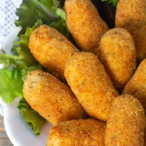 Close up of crispy crab croquettes on a plate.