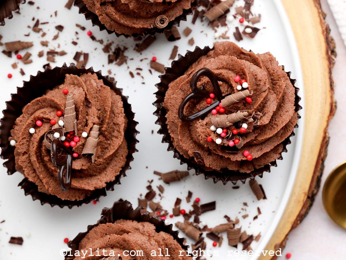 Closeup of chocolate mousse cups decorated with red and white sprinkles