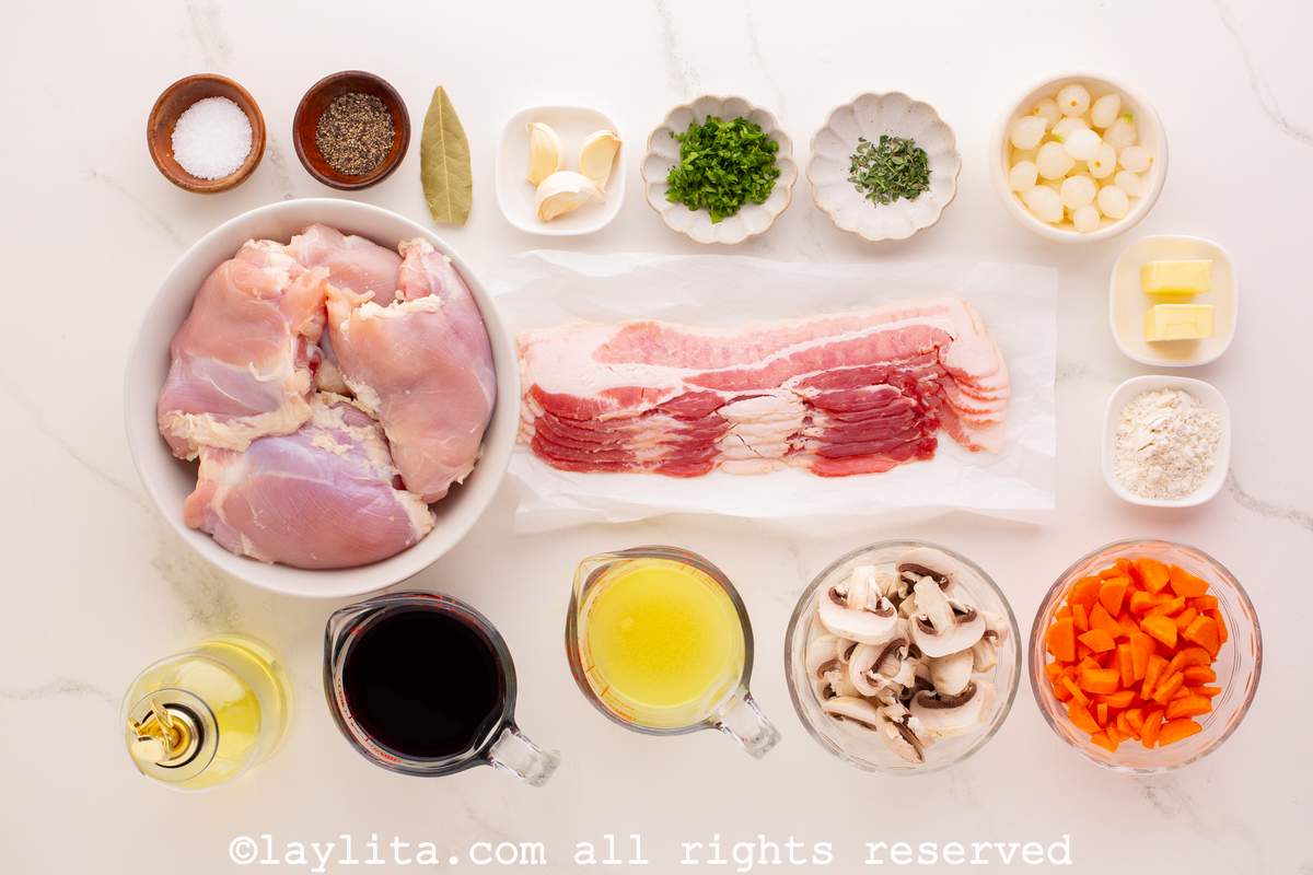 Ingredients for French Coq au Vin or Chicken in Red Wine sauce on a kitchen counter