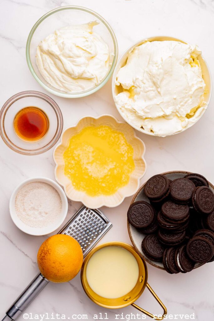 Ingredients needed to make Oreo cheesecake on a counter