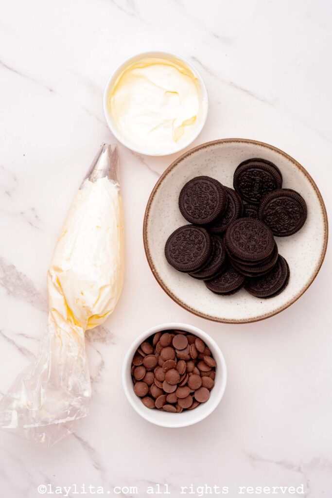 Ingredients needed for Oreo cheesecake toppings on a counter.