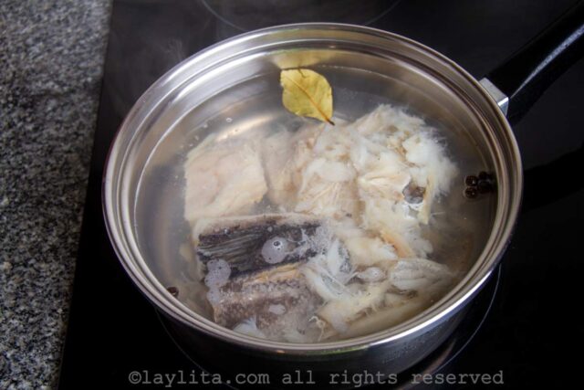 Salted cod cooking in a pot with water