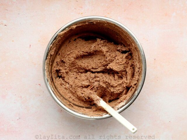 Eggless chocolate mousse with whipped cream in a mixing bowl
