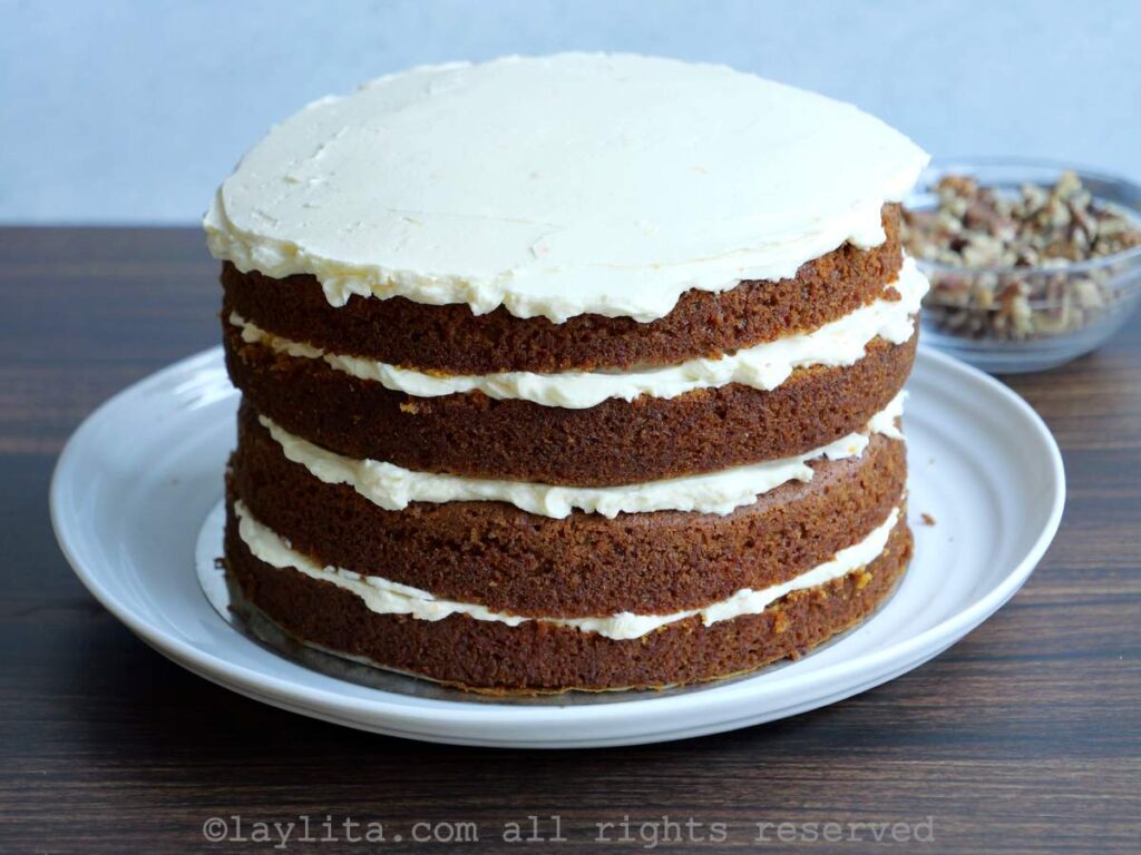 A naked carrot cake with cream cheese frosting 