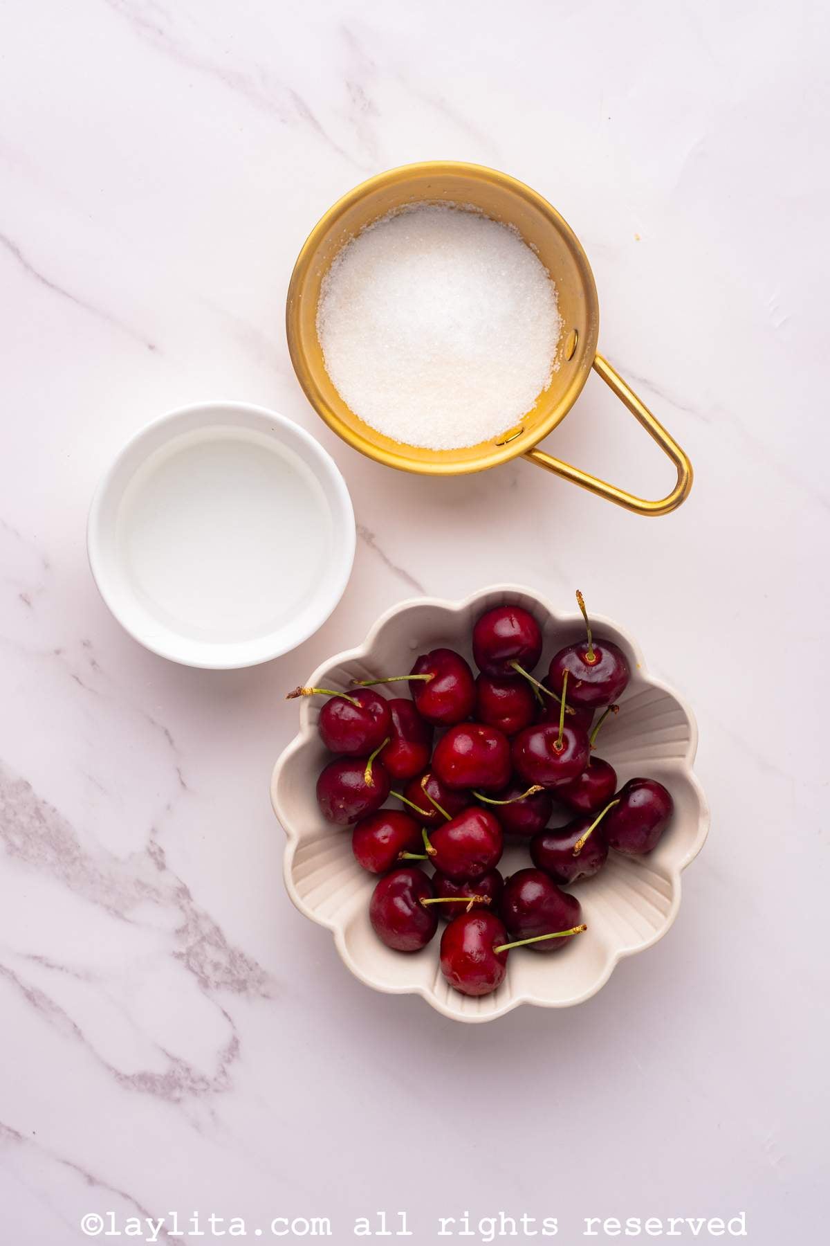 Ingredients for a Cherry Compote Topping sauce on a kitchen counter