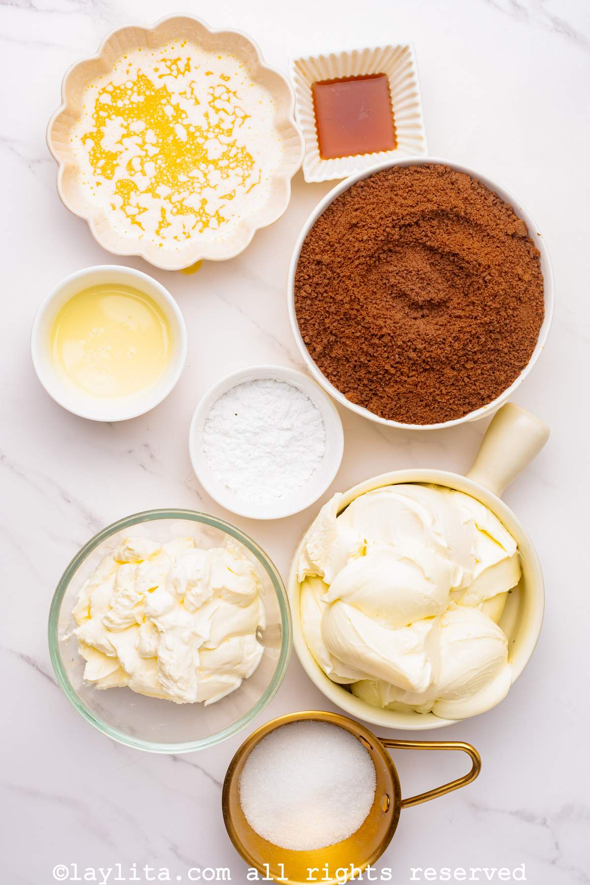 Ingredients for a no bake cheesecake with chocolate crust on a kitchen counter