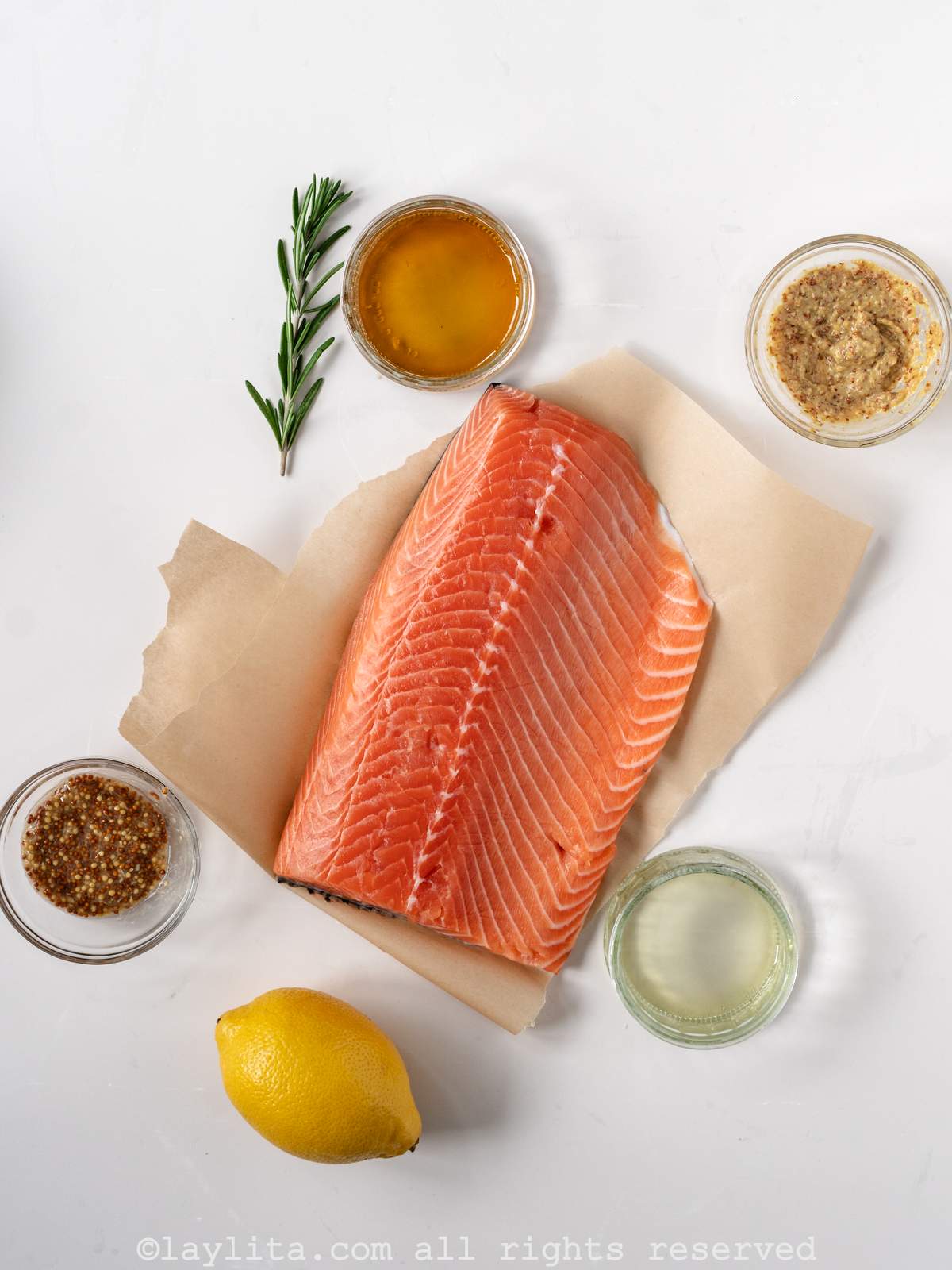 Ingredients for maple mustard roasted salmon on a kitchen counter