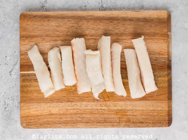 Fish strips on a cutting board