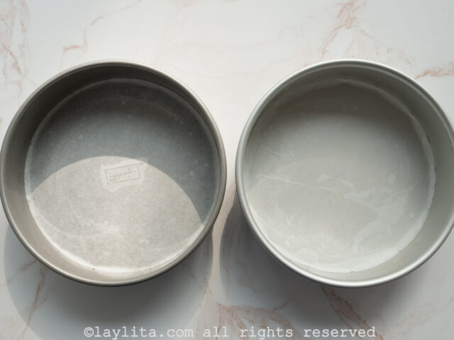 Grease the cake pans and line them with parchment paper liners