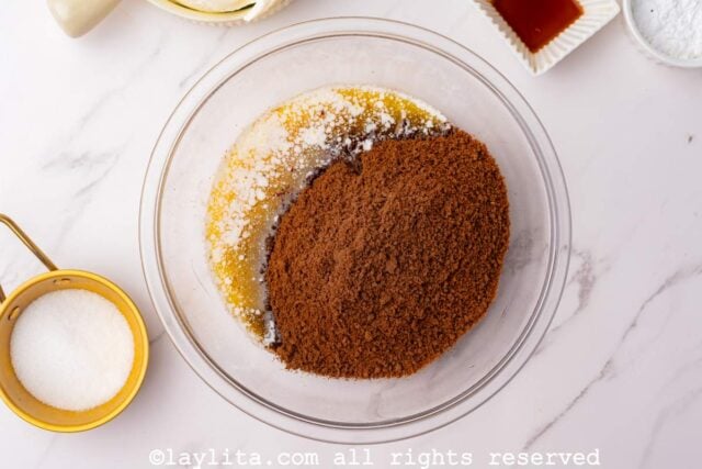 Chocolate cookie crumbs and melted butter in a bowl
