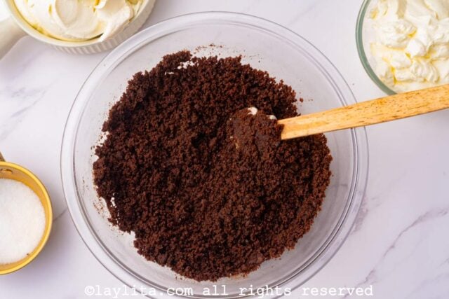 Mix until the chocolate crumbs feel like wet sand.