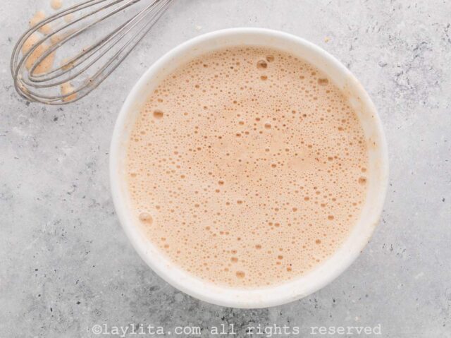 Add the beer to the flour mixture and whisk until there are no more lumps. The mixture will bubble and foam a lot.