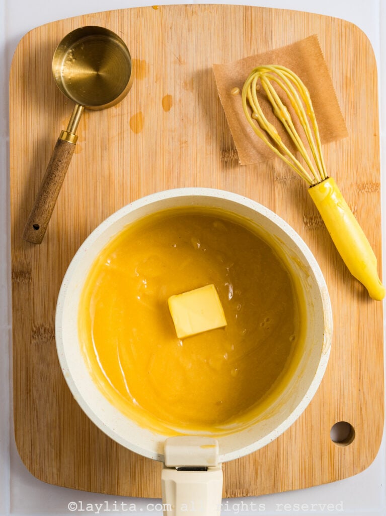 Adding lemon juice and butter to the custard