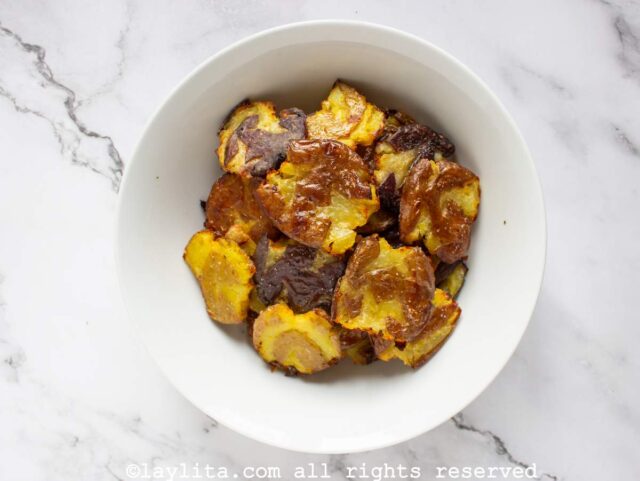 Crispy smashed potatoes in a salad bowl