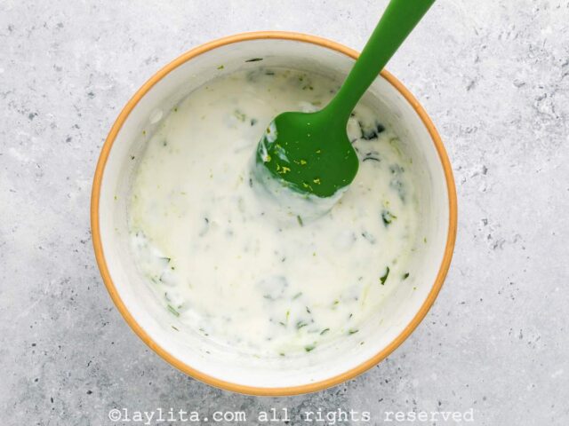 Lime cilantro crema sauce in a small bowl