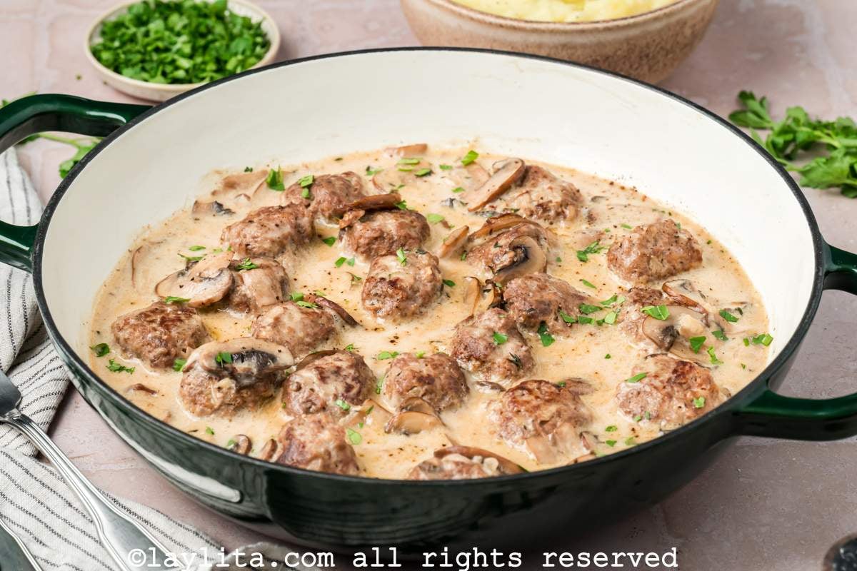 Beef stroganoff meatballs in a creamy sauce in a skillet