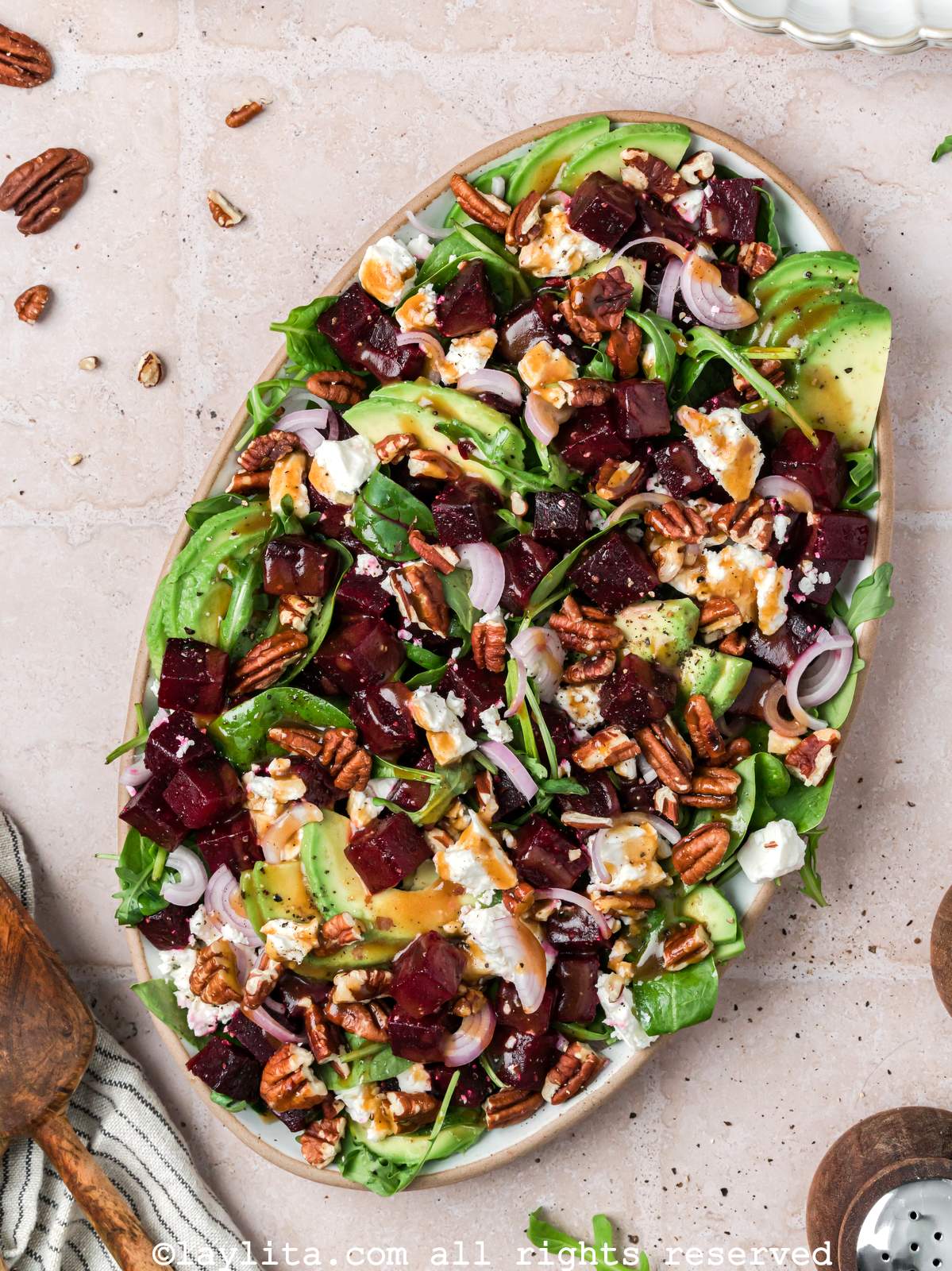 Overhead shot of a beet salad with feta cheese on a serving platter