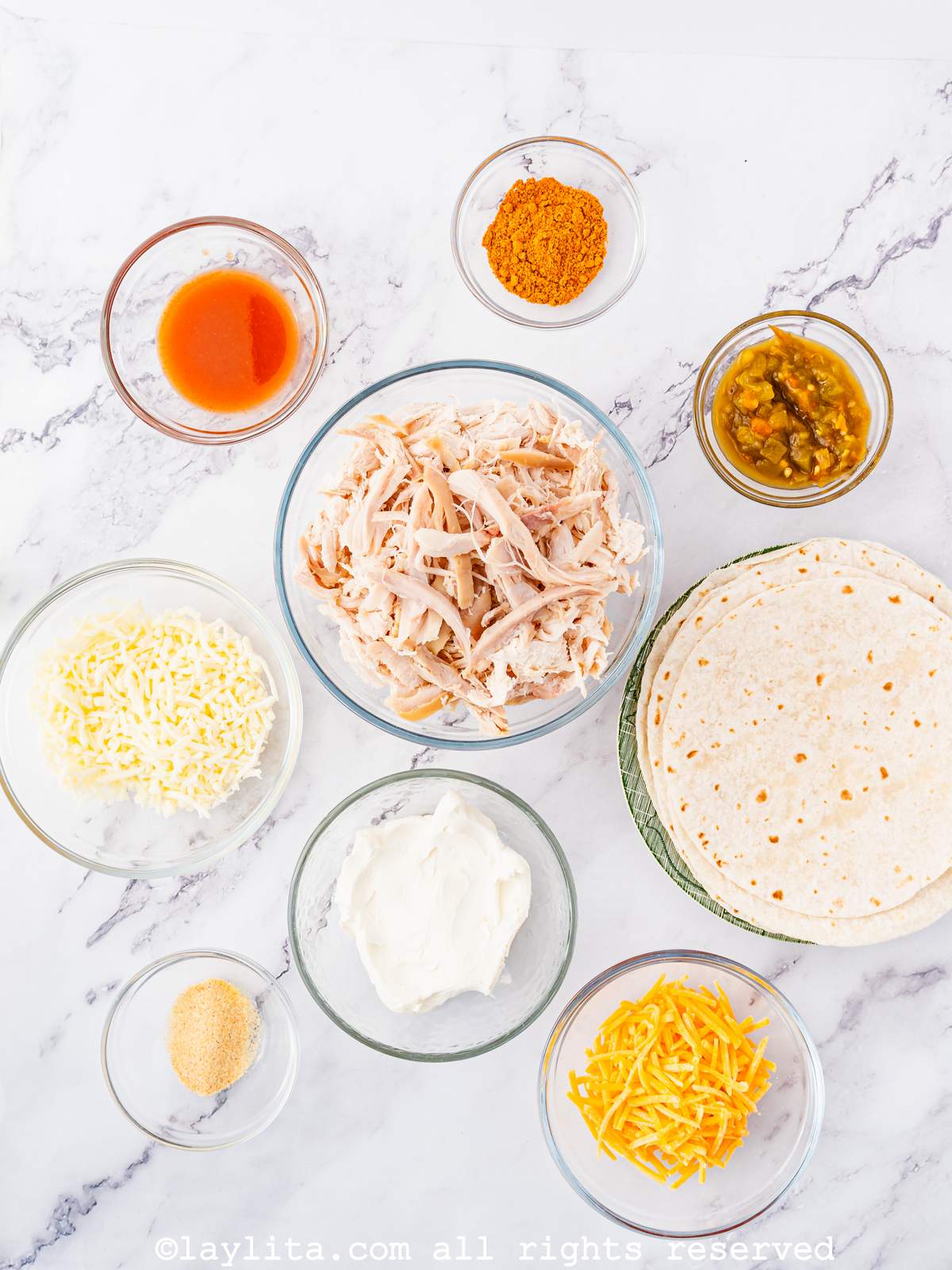 Overhead shot of the ingredients needed for Air Fryer Chicken Taquitos on a kitchen counter