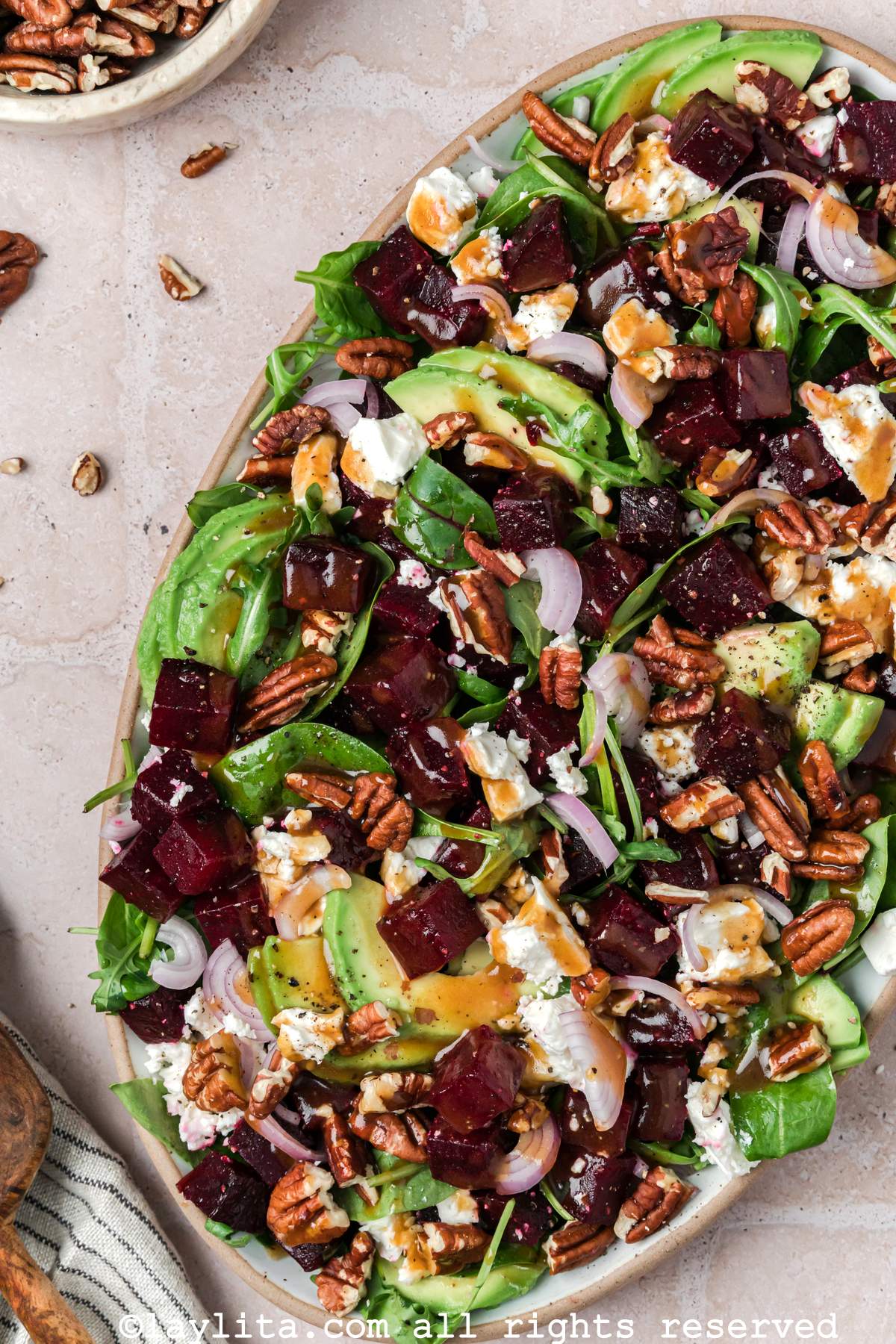 Overhead view of a salad with beets and feta cheese on a serving platter