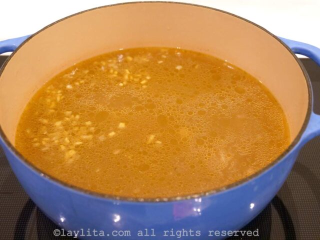 Beef broth simmering in a pot