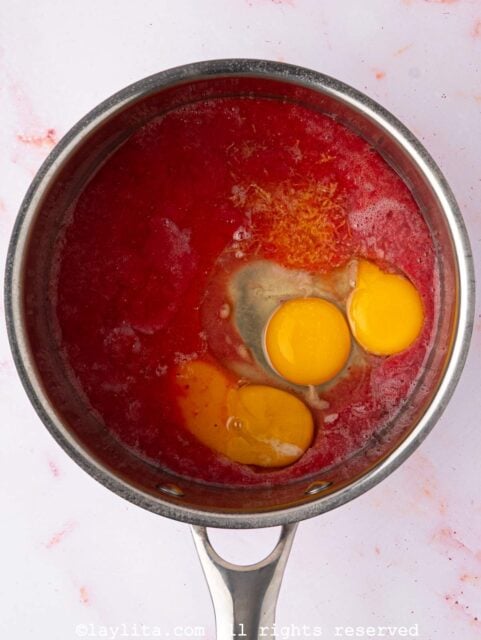 Strawberry puree, egg, egg yolks, sugar, lemon juice, lemon zest, and salt in a small saucepan