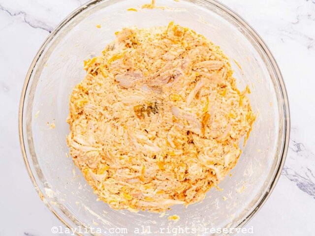 Chicken and cheese mixture in a glass bowl
