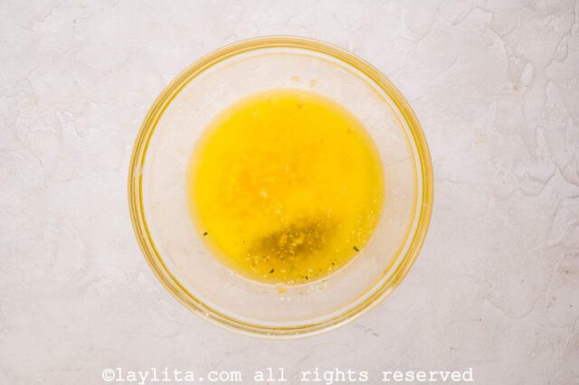 In a small mixing bowl, combine the butter, minced garlic, and 2 teaspoons garlic salt.
