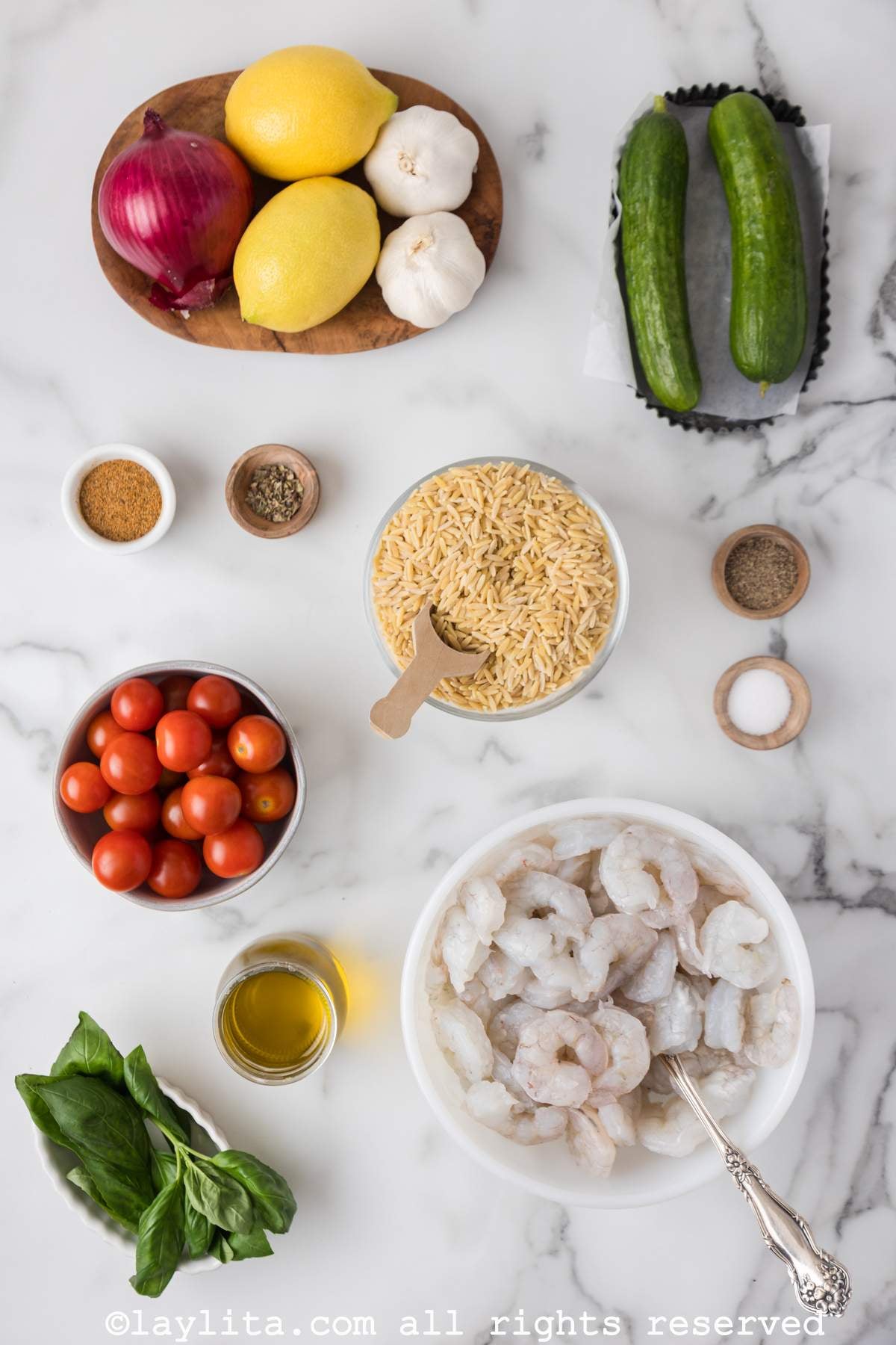 Ingredients needed for Lemon Orzo Pasta Salad with Grilled Shrimp Skewers on a kitchen counter