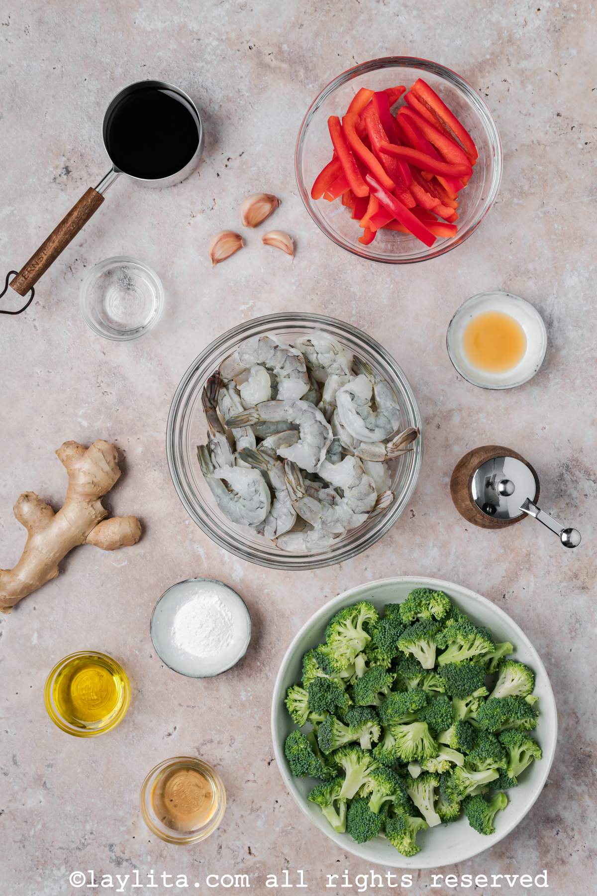 Ingredients needed to make shrimp broccoli stir fry on a kitchen counter.