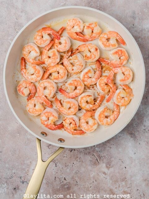 Shrimp cooking in a skillet