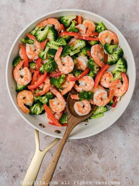 Preparing a shrimp and veggie stir fry